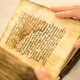 Illustration for article titled Particle Accelerator Reveals Ancient Greek Medical Text Beneath Religious Psalms on Parchment